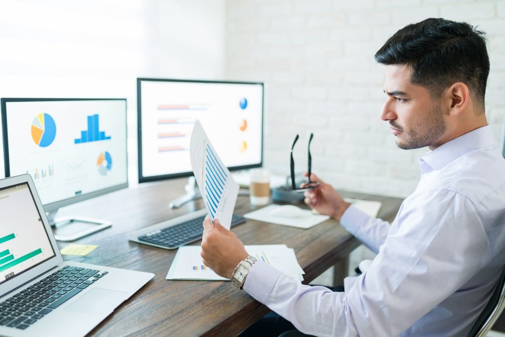 Businessman Examining Sales Data