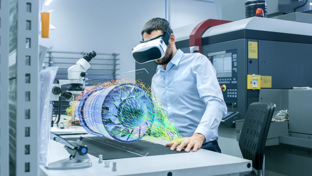 Factory Chief Engineer Wearing VR Headset Designs Engine Turbine on the Holographic Projection Table. Futuristic Design of Virtual Mixed Reality Application. virtual reality for training